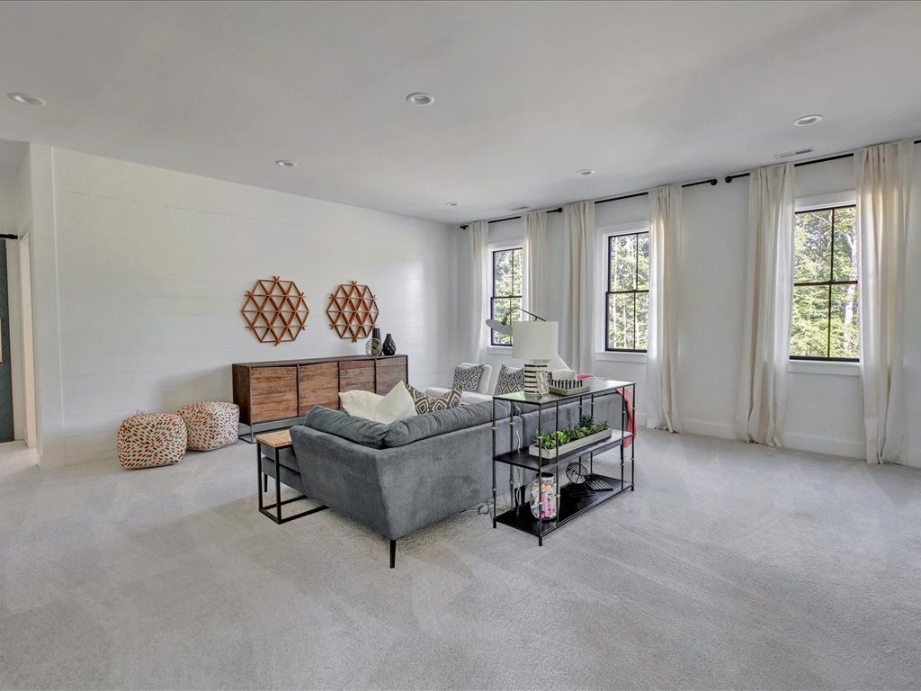 Upstairs bonus room with tall windows