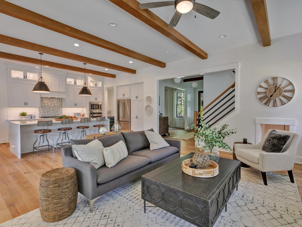 Living area open to kitchen with beamed ceiling